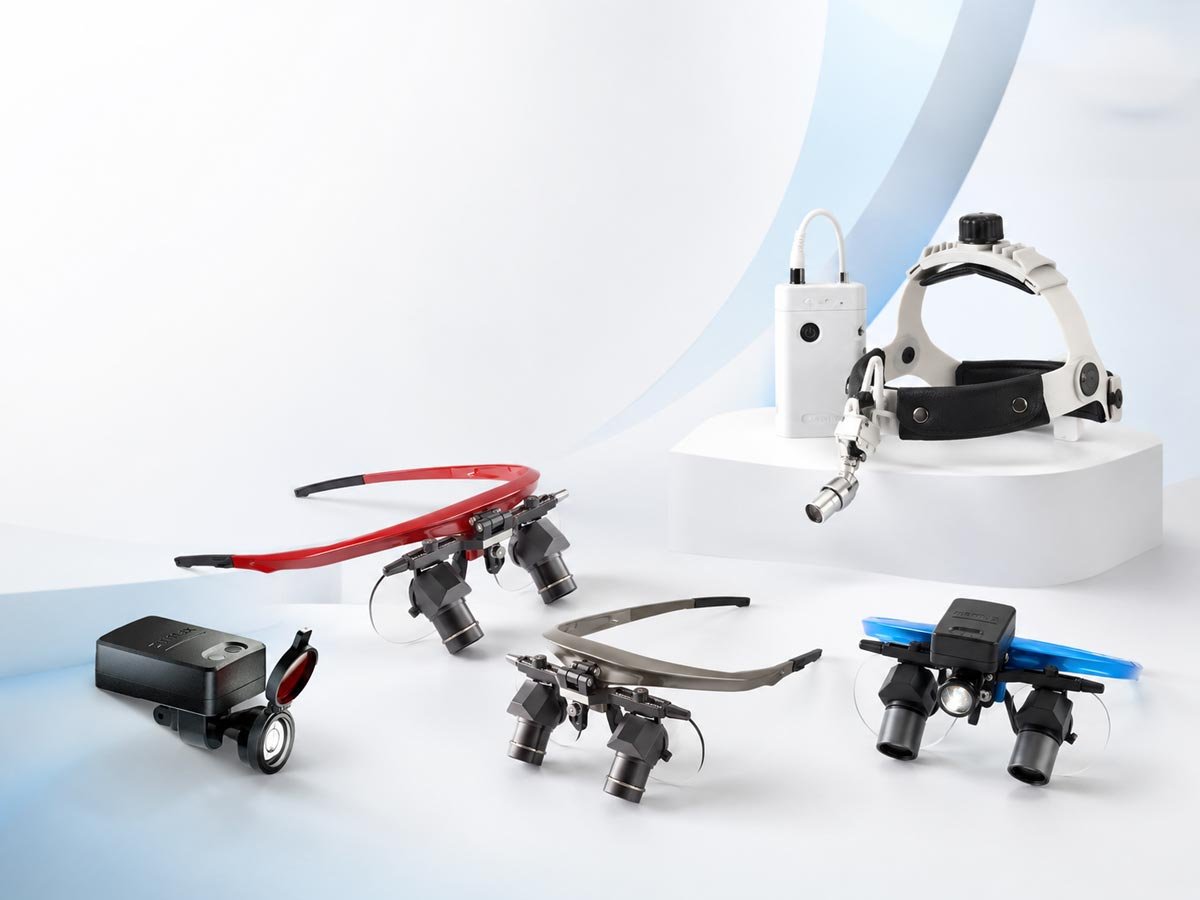 Opticlar dental loupes and lighting systems displayed on a clinical background